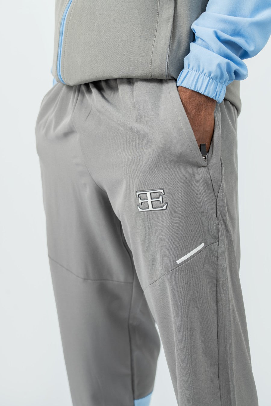 grey tracksuit joggers with hand going into the pocket