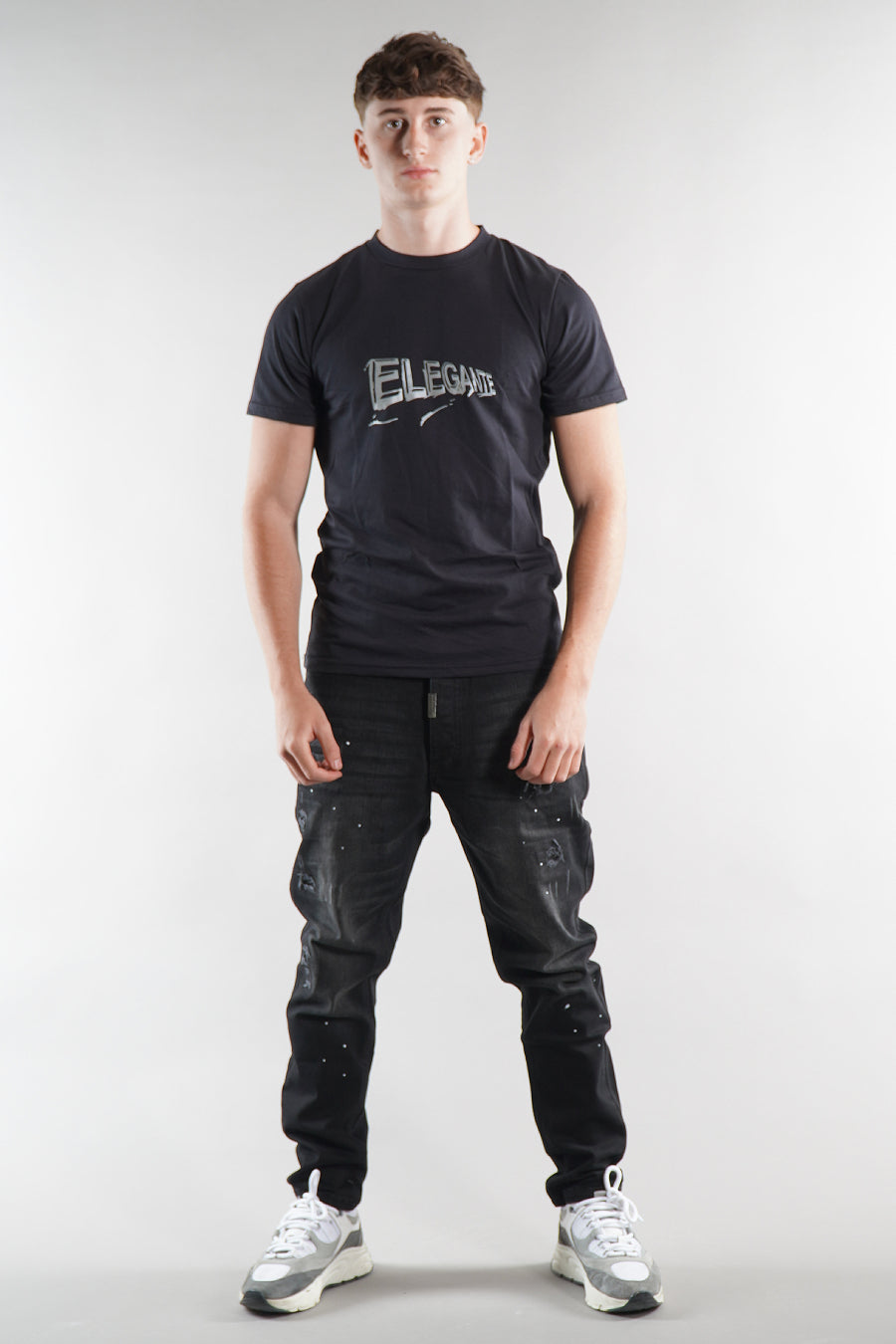 man wearing designer Elegante t-shirt and Jeans on white background