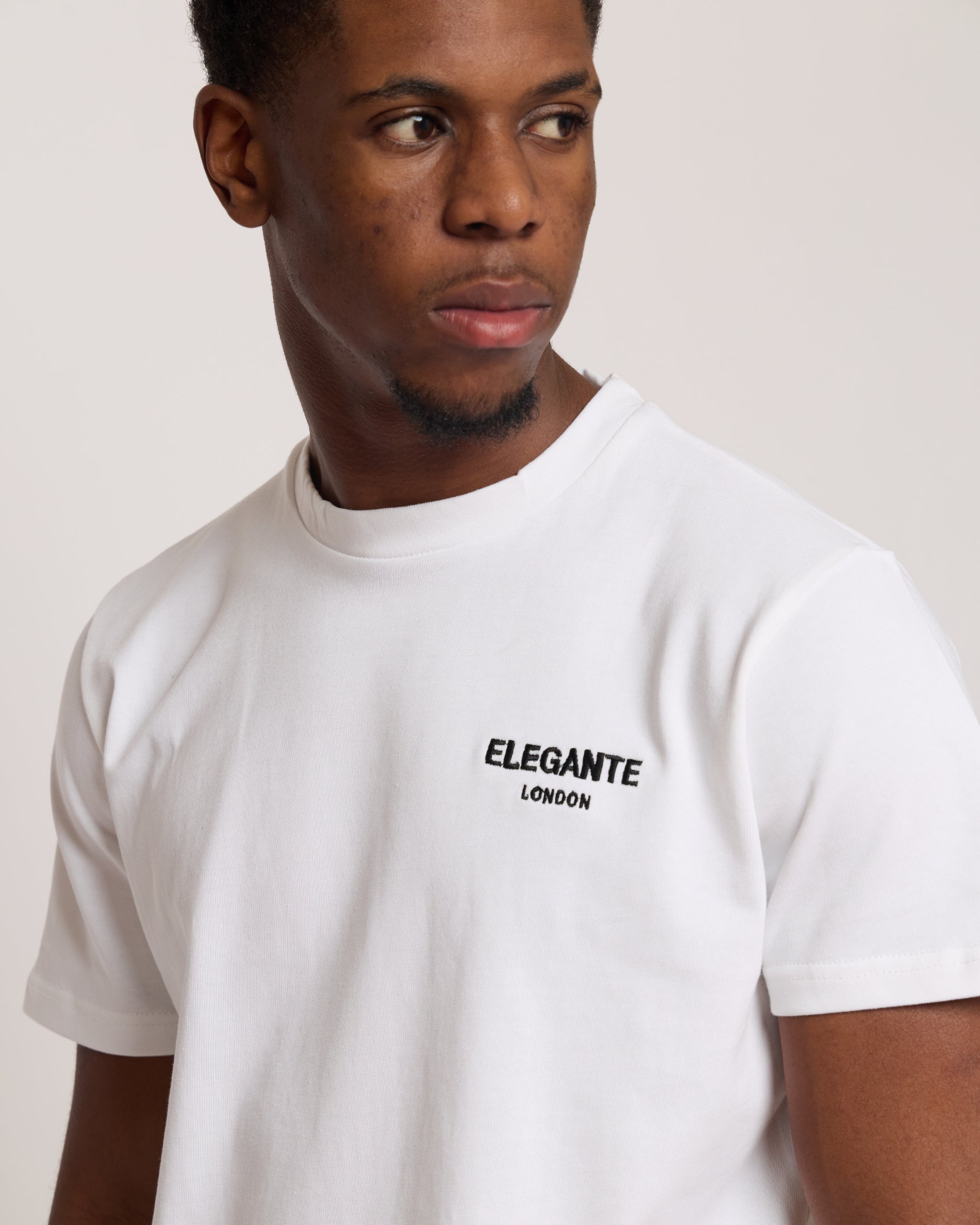 Man wearing a white cotton t-shirt with E logo