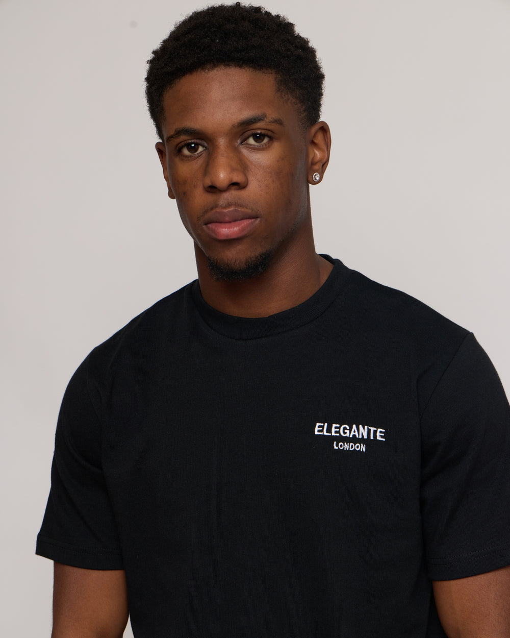 Man wearing a Black cotton t-shirt with E logo 