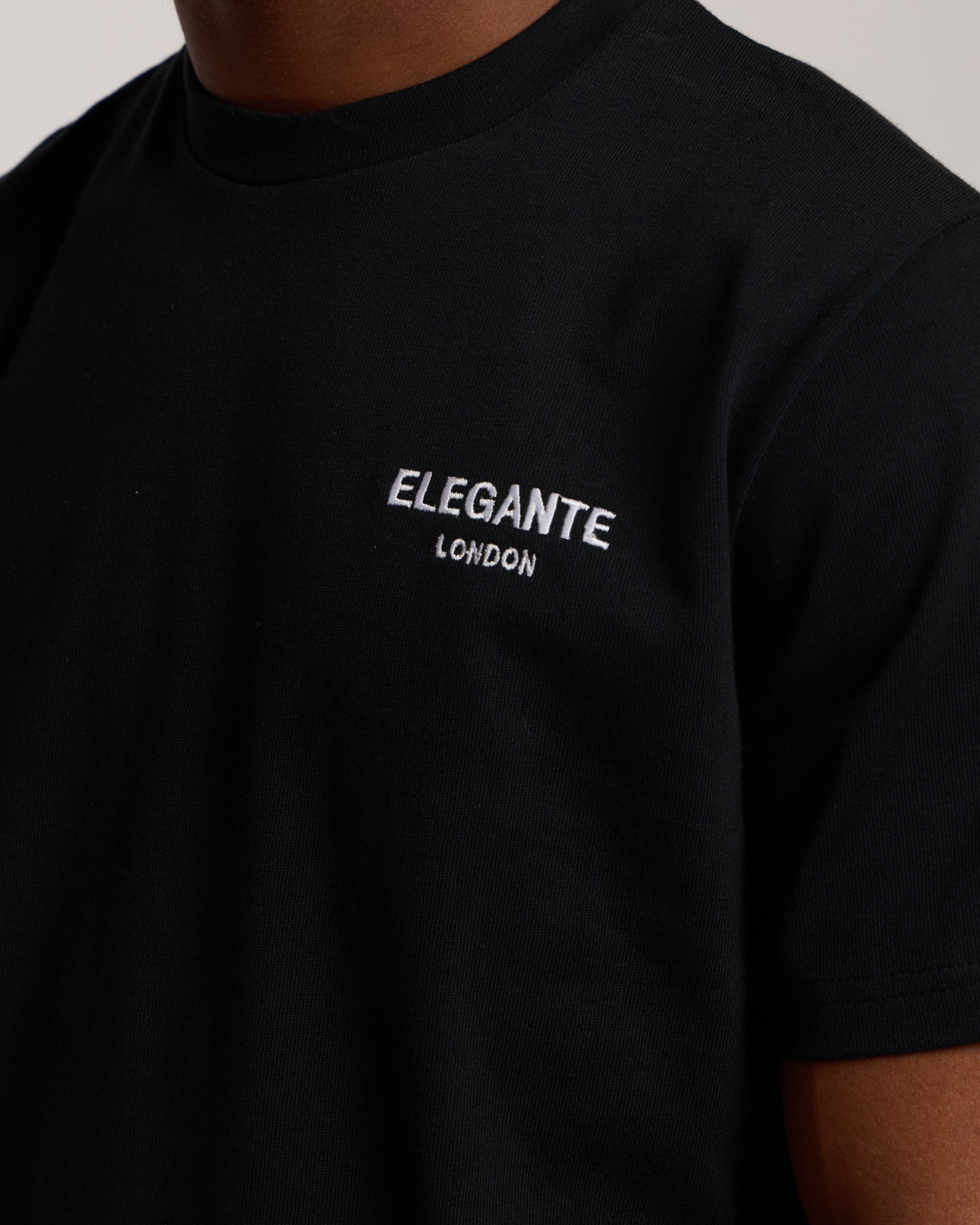 Man wearing a black cotton t-shirt 