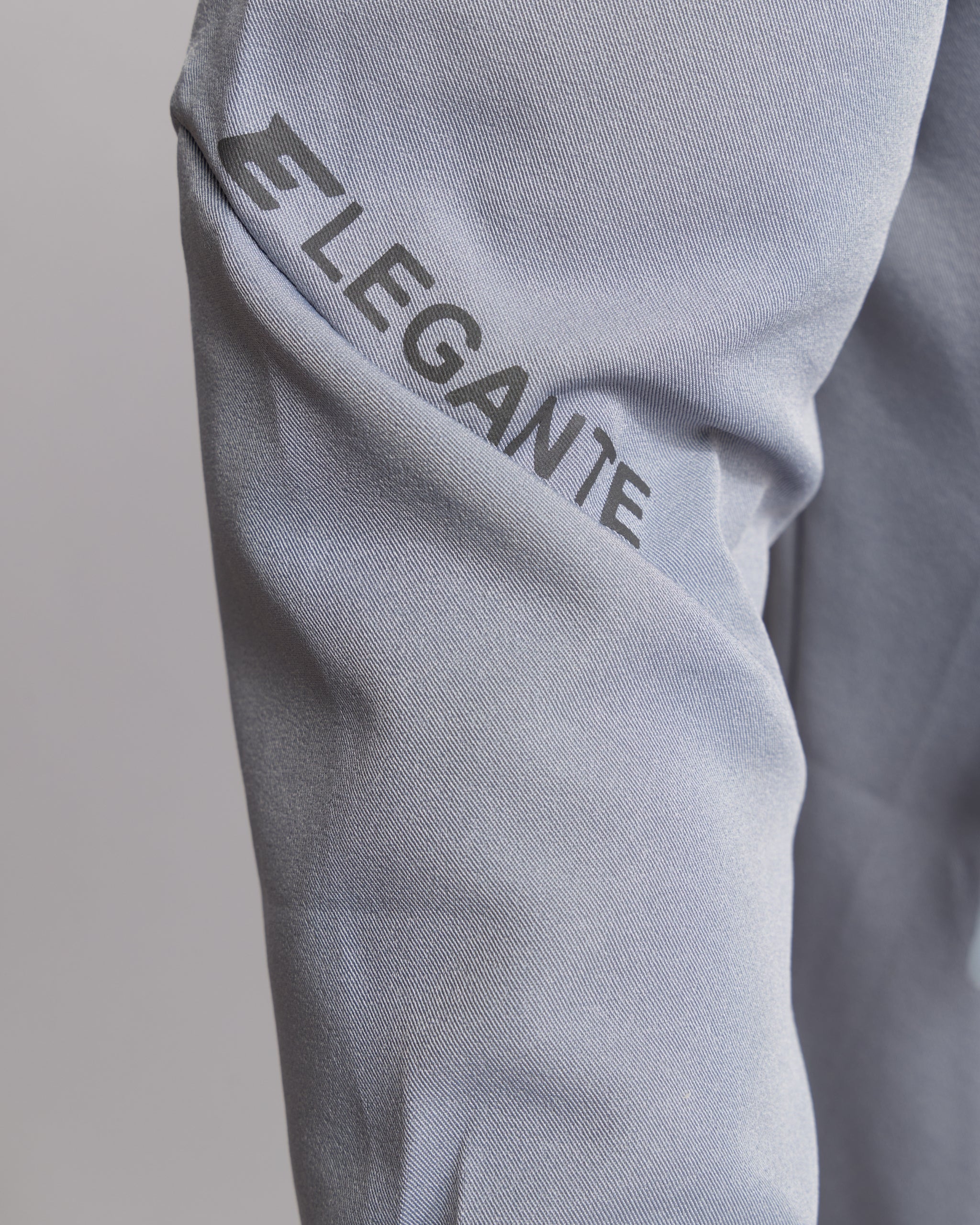 Elegante text on grey trouser leg