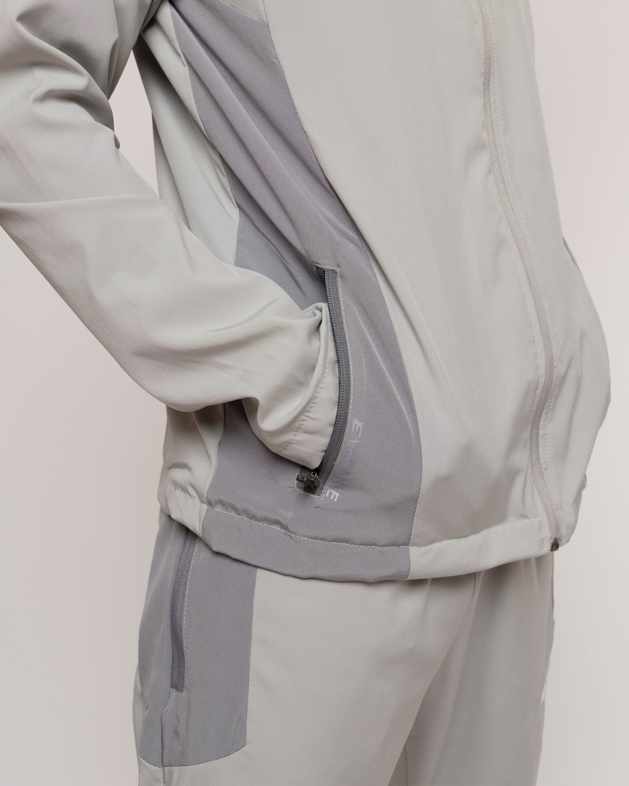 Man wearing a light gray jacket 