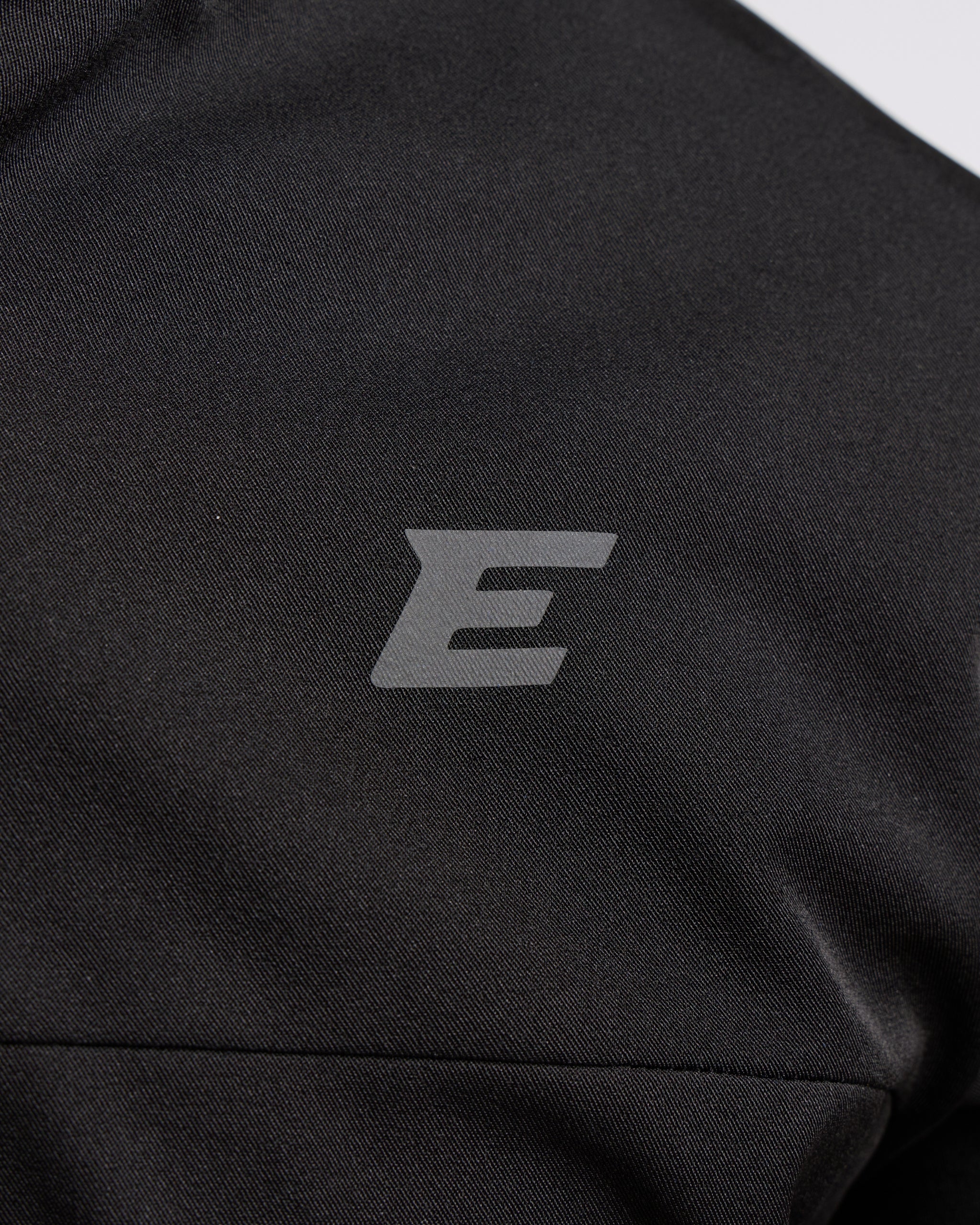 Black jacket with a logo on the chest