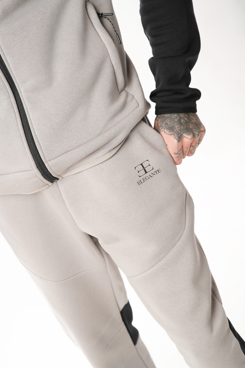 Light gray tracksuit with elegante brand logo on a white background