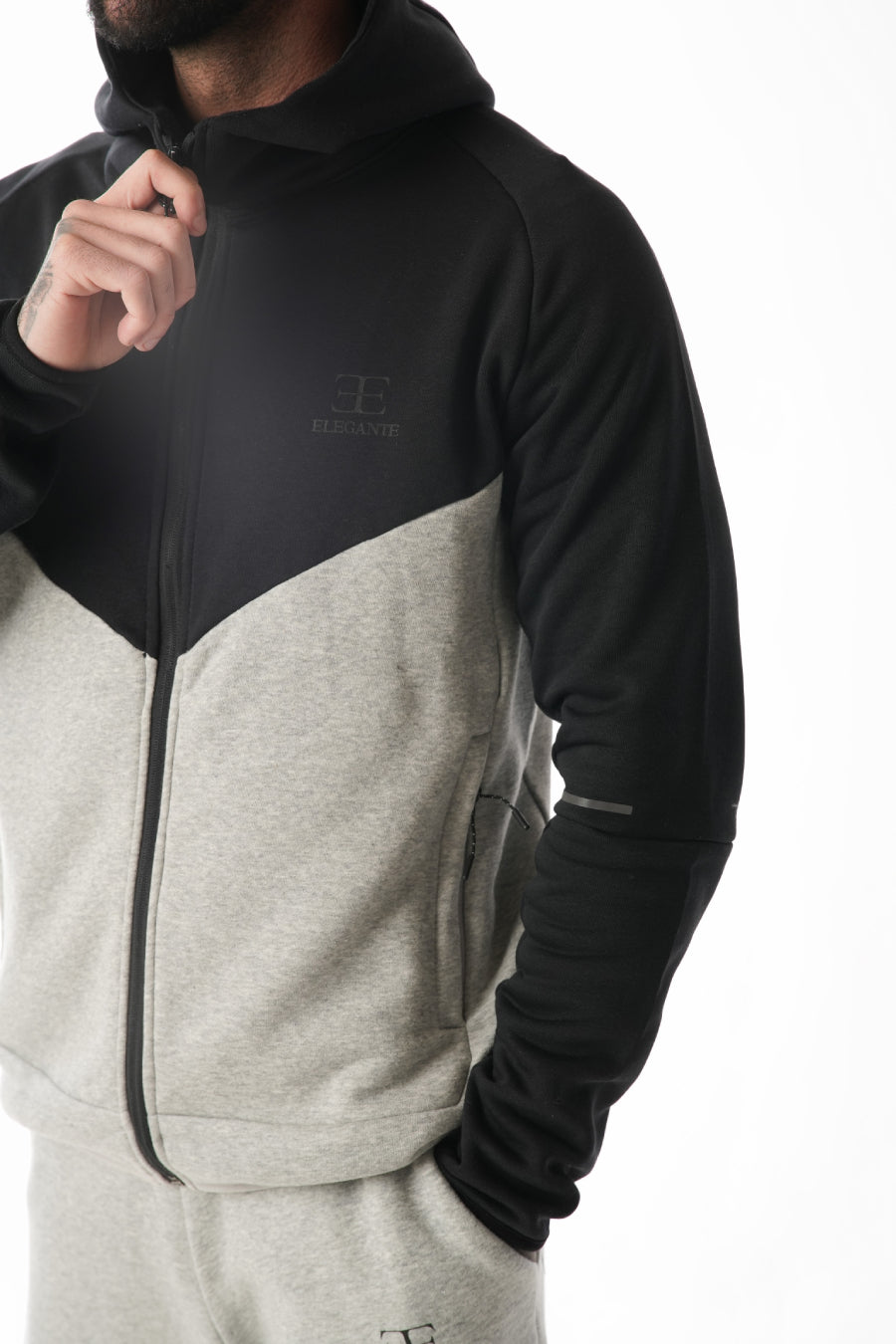 Two-tone black and gray hoodie with elegante brand logo on a white background