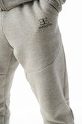 Gray sweatpants with elegante brand logo on a white background