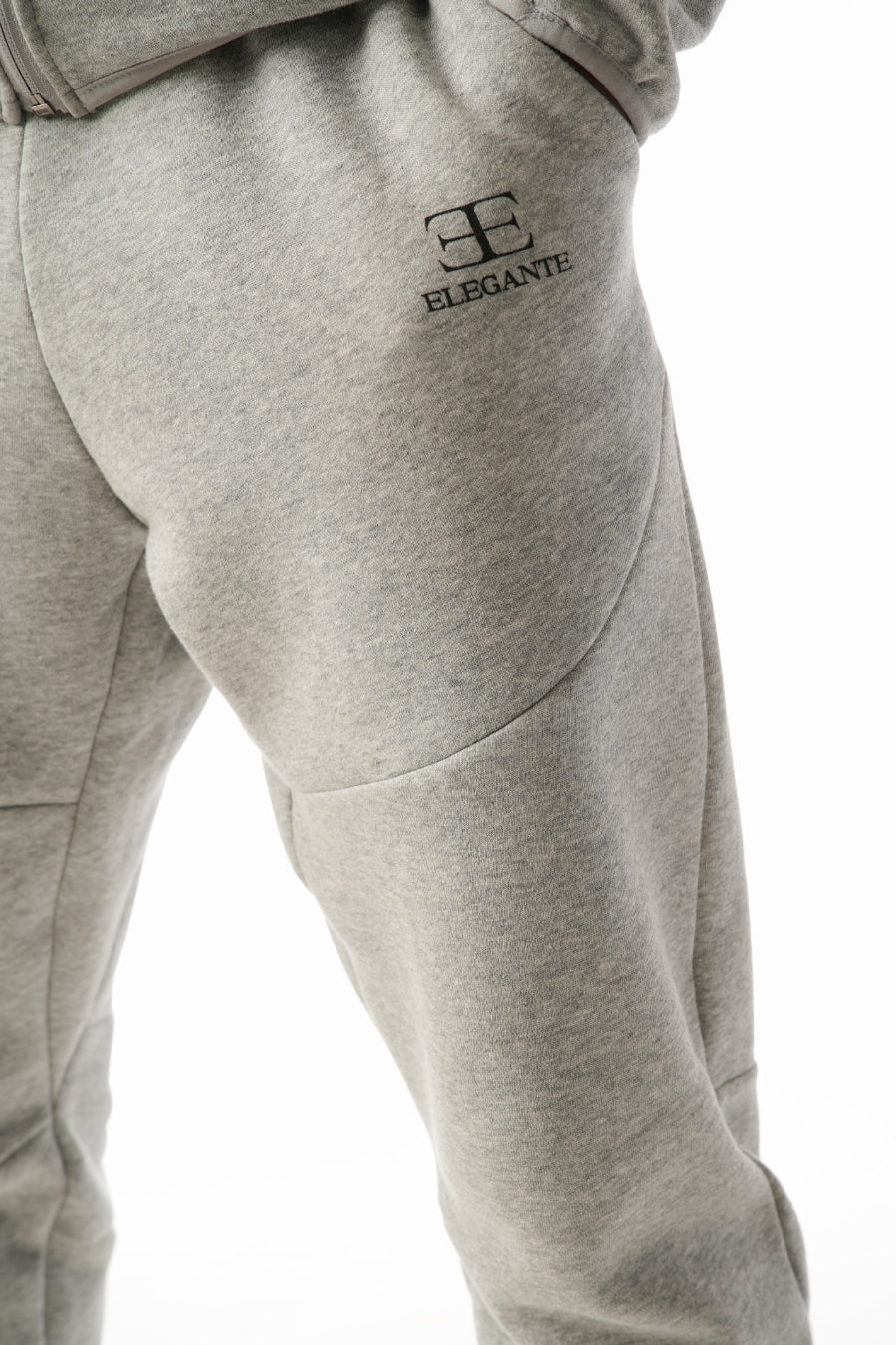 Gray sweatpants with elegante brand logo on a white background