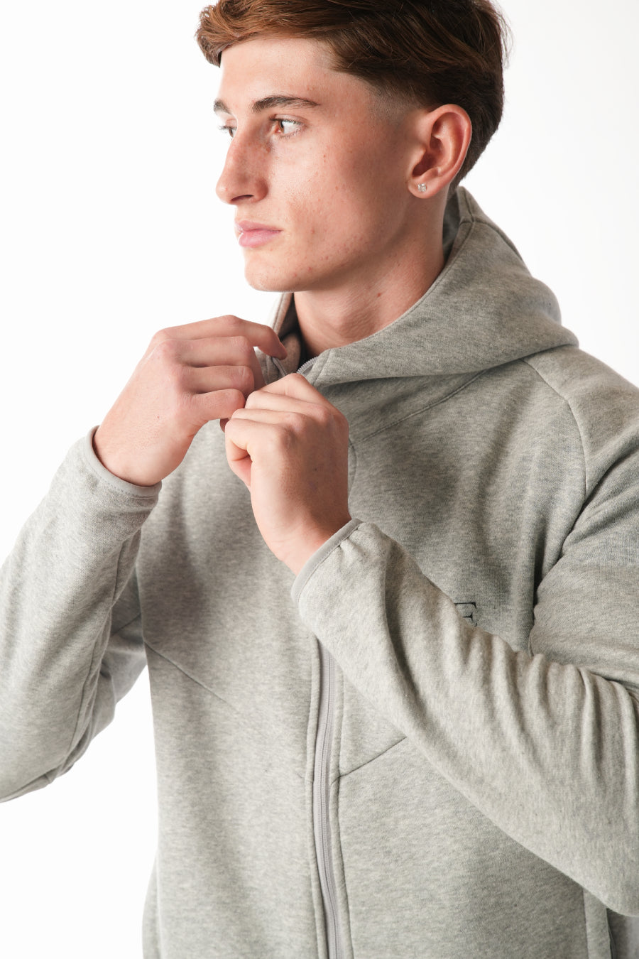 Man wearing Hazel Grey tracksuit on white background