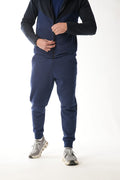 Man wearing midnight blue navy Tracksuit on white background