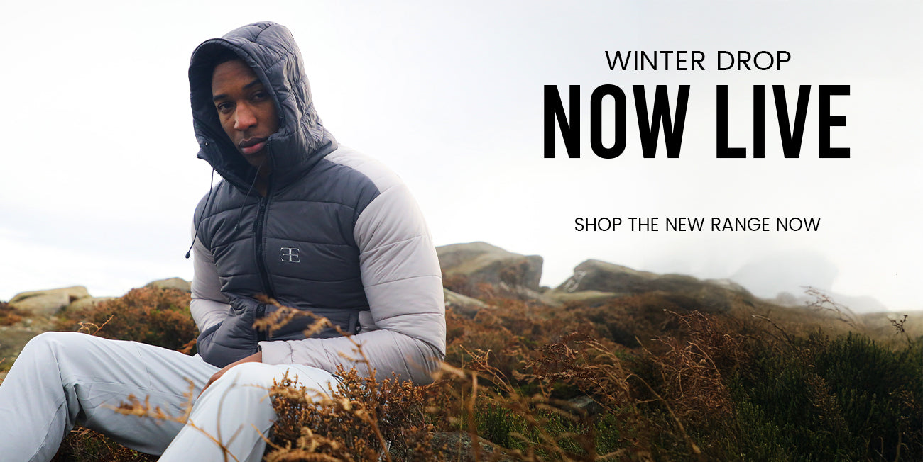 man wearing grey puffer jacket banner