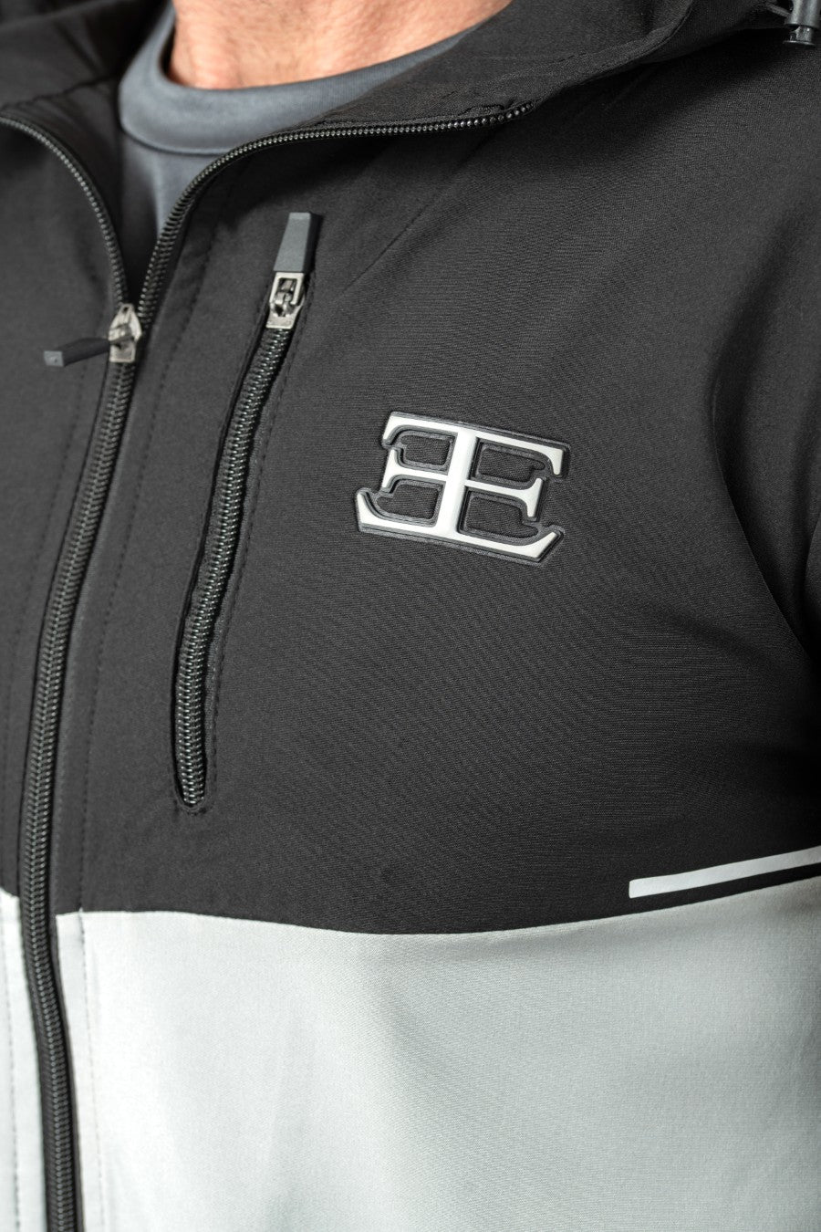 Black and gray jacket with elegante london logo on the chest