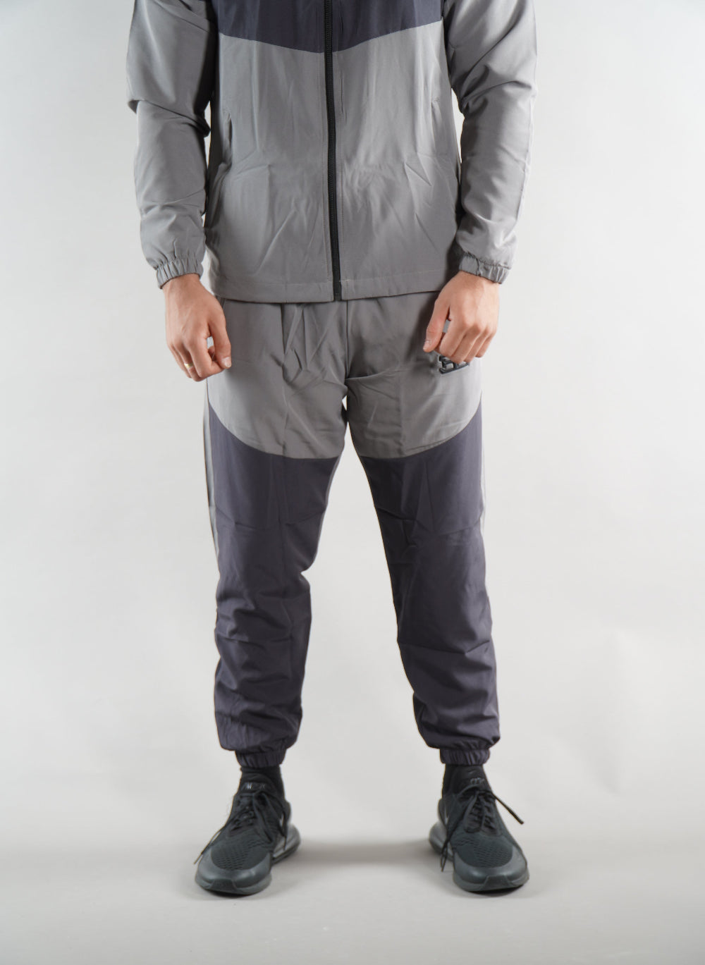 man wearing Grey Tracksuit joggers and tracksuit jacket with hood, activewear clothing