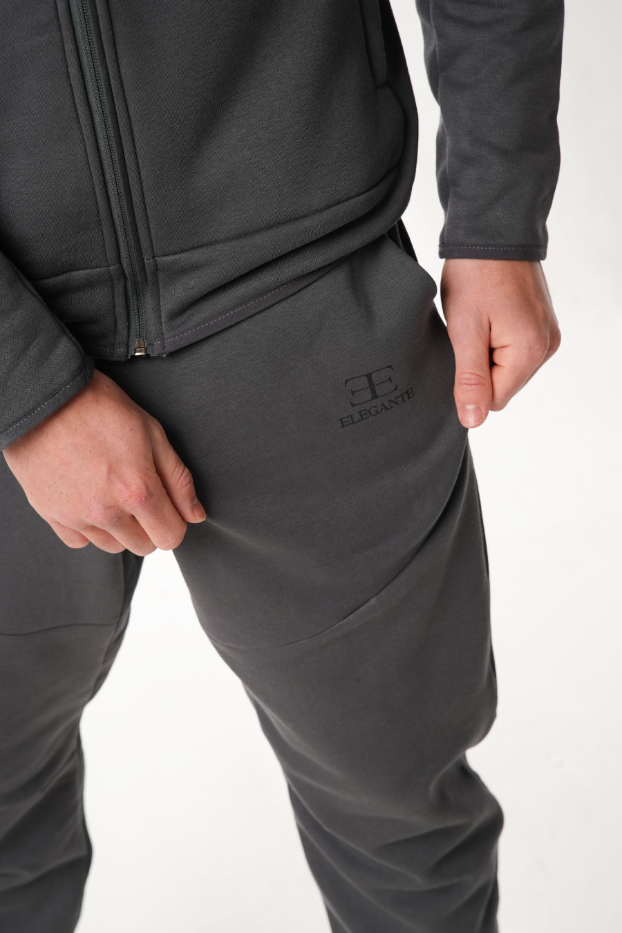 Dark gray tracksuit with elegante brand logo on a white background