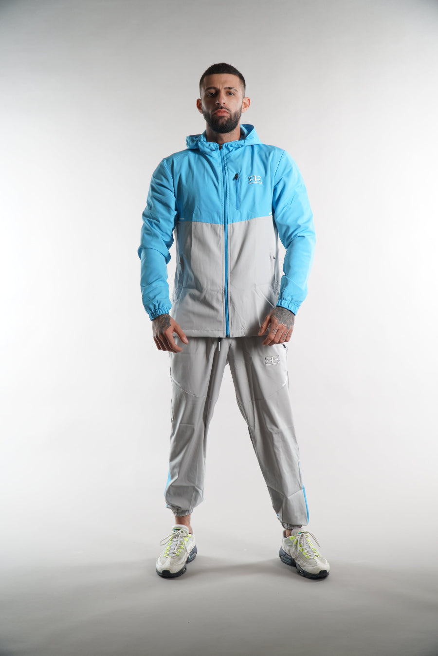 man wearing Elegante Tracksuit jacket & joggers with hood in sky blue, JD sports jackets, activewear, mens street clothing