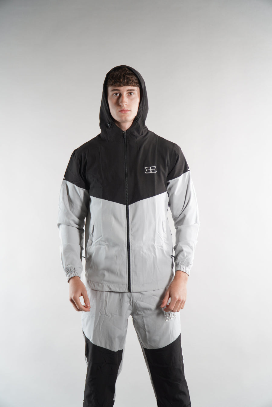 man wearing Black Grey Joggers and jacket Tracksuit set