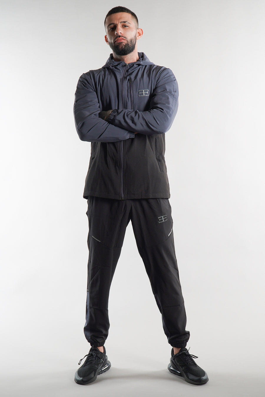 man wearing Elegante Black steel grey joggers with tracksuit jacket set, sportswear
