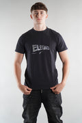 man wearing Elegante logo T-Shirt in black with black denim jeans on white background
