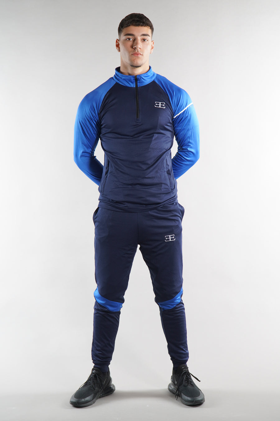 man wearing Elegante blue Gym tracksuit set with zip top, activewear for men