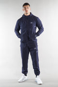 Man wearing a navy tracksuit with a elegante on a white background