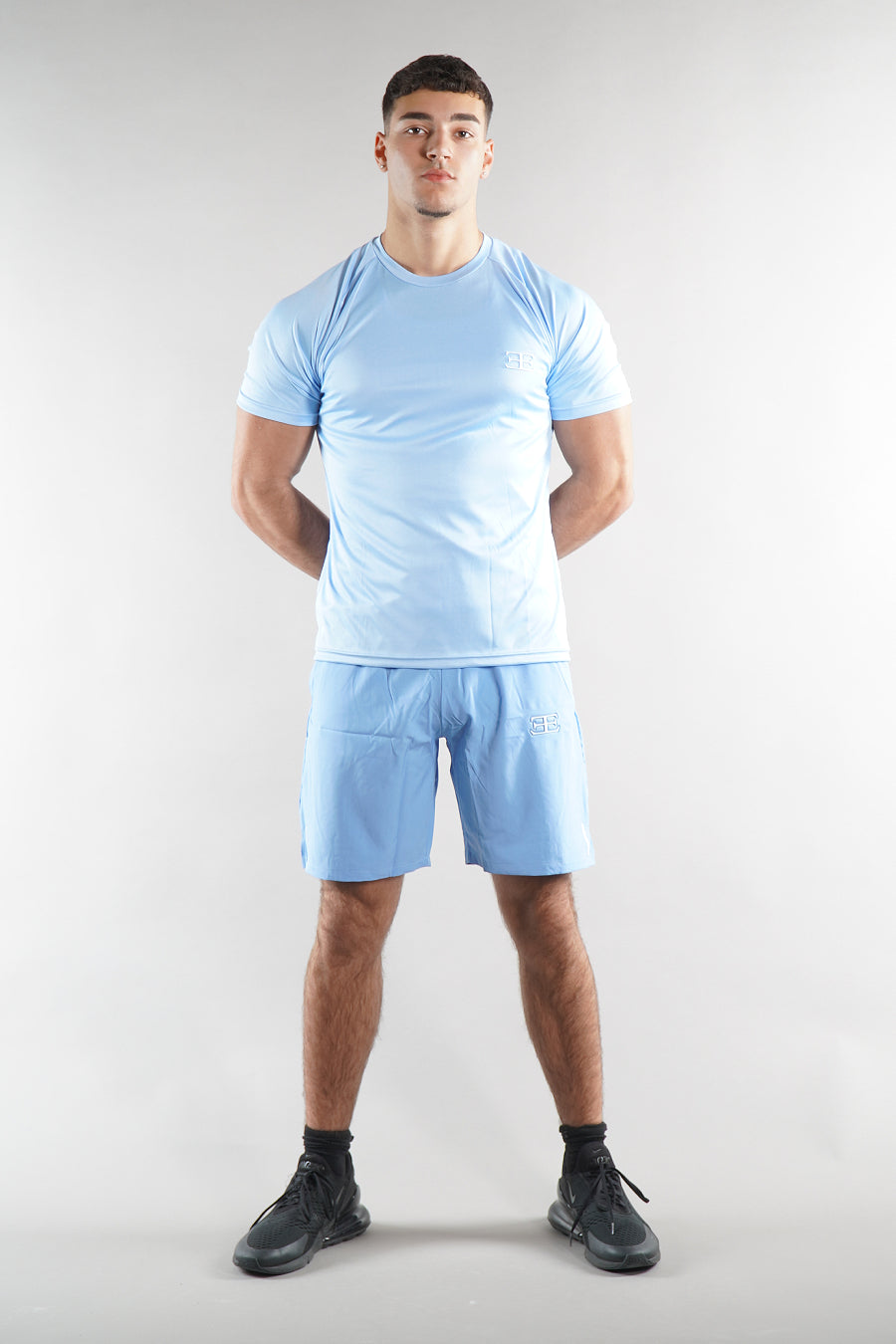 man wearing Elegante blue Gym Shorts and tshirt set, activewear for men