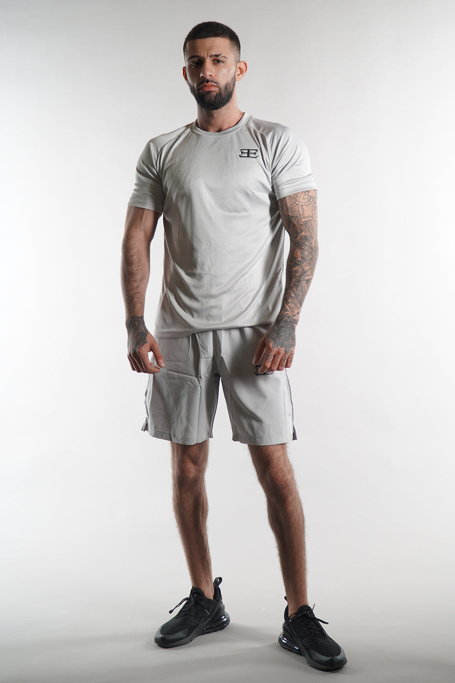 man wearing Elegante grey Gym Shorts and tshirt set, activewear for men