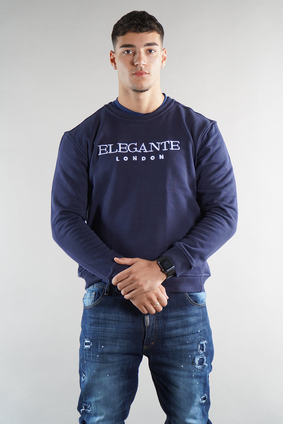 man wearing navy elegante logo jumper sweatshirt  on white background