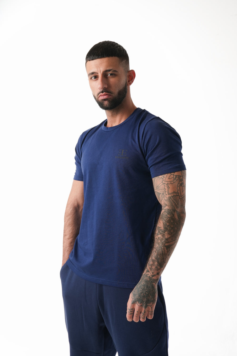 Man wearing a blue athletic outfit on a white background