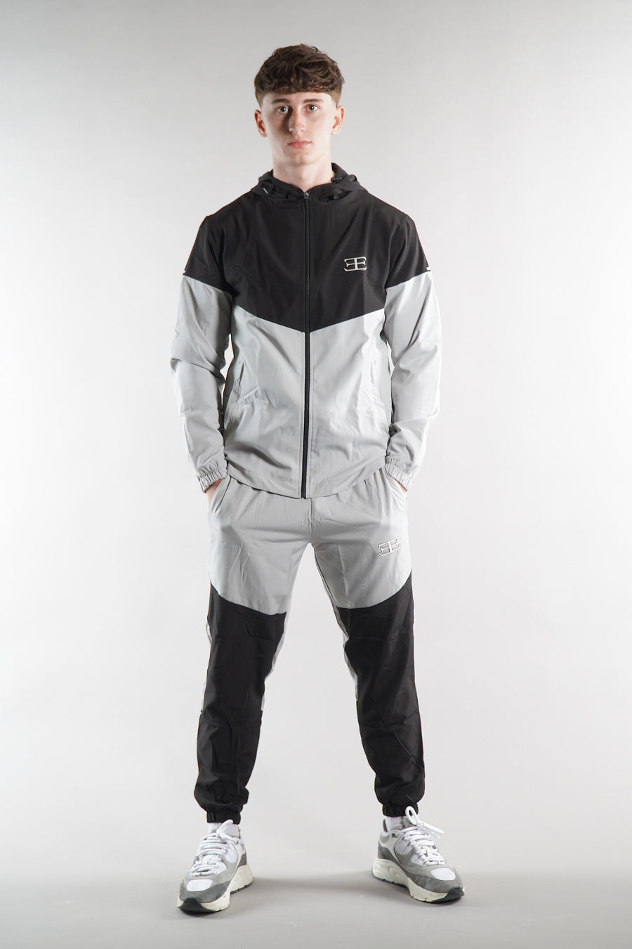 man wearing Elegante Black and grey tracksuit, tracksuit set, activewear for men, 